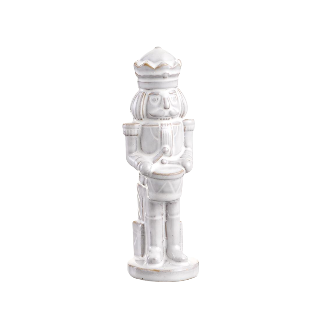 White ceramic nutcracker figurine on a white background