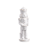 White ceramic nutcracker figurine on a white background