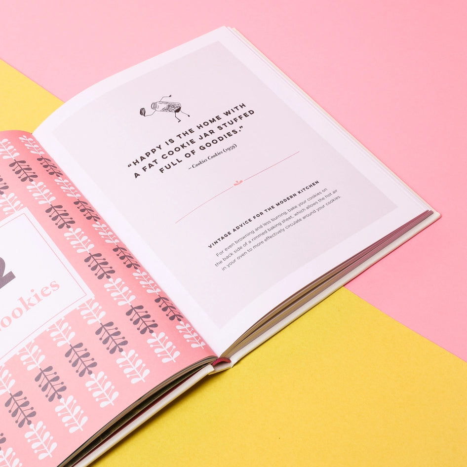 Open book with text on a pink and yellow background