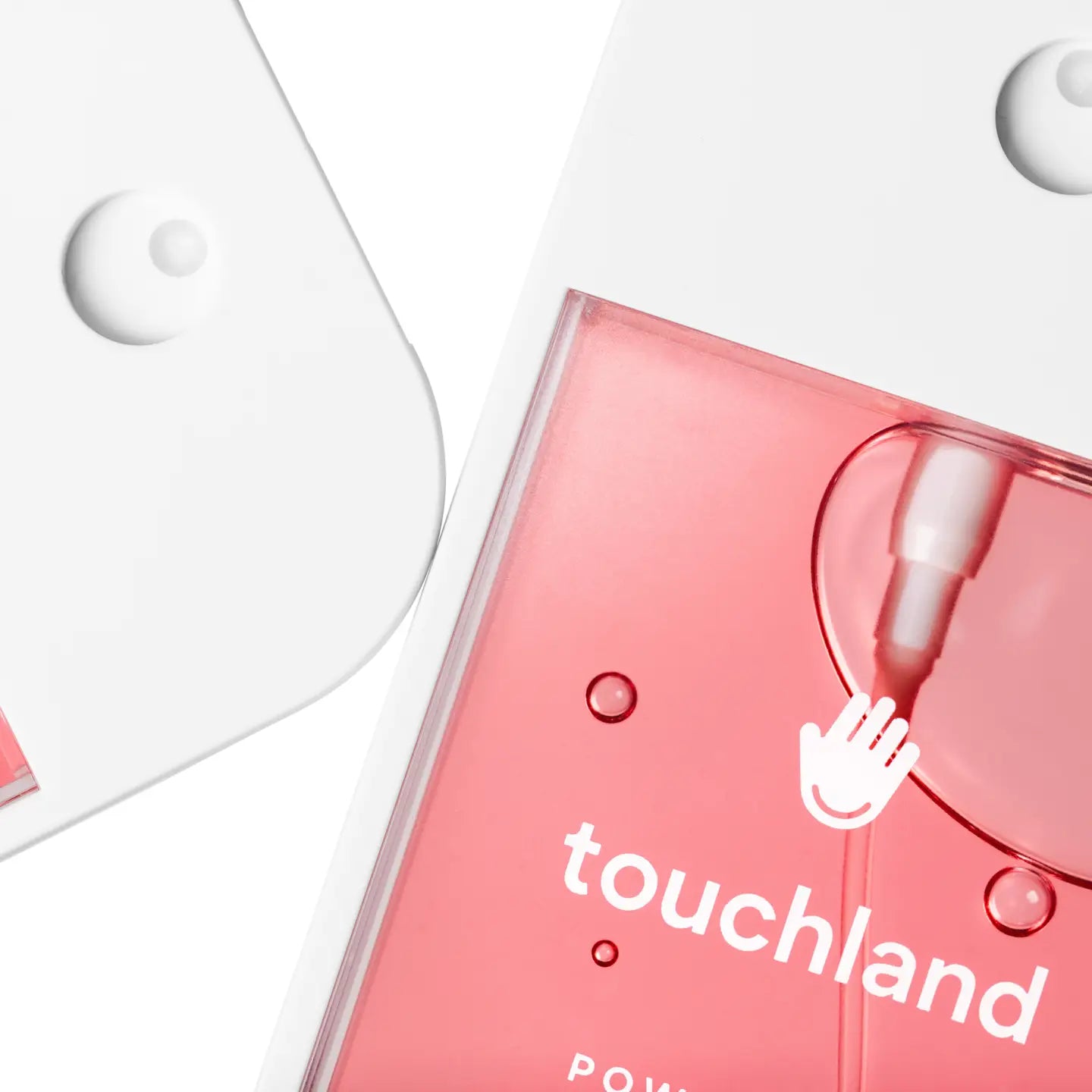 Pink skincare product with 'touchland' branding on a white background
