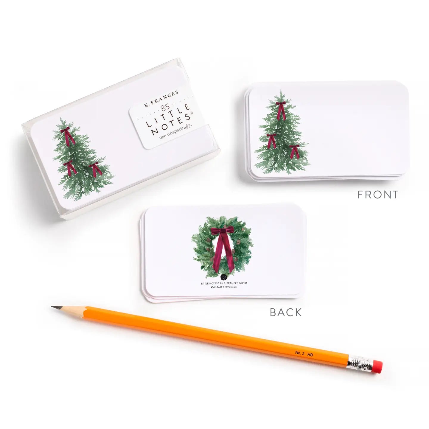 Set of Christmas-themed cards with a pencil on a white background