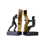 Rodari Bookends showing two figures pushing and pulling on white background