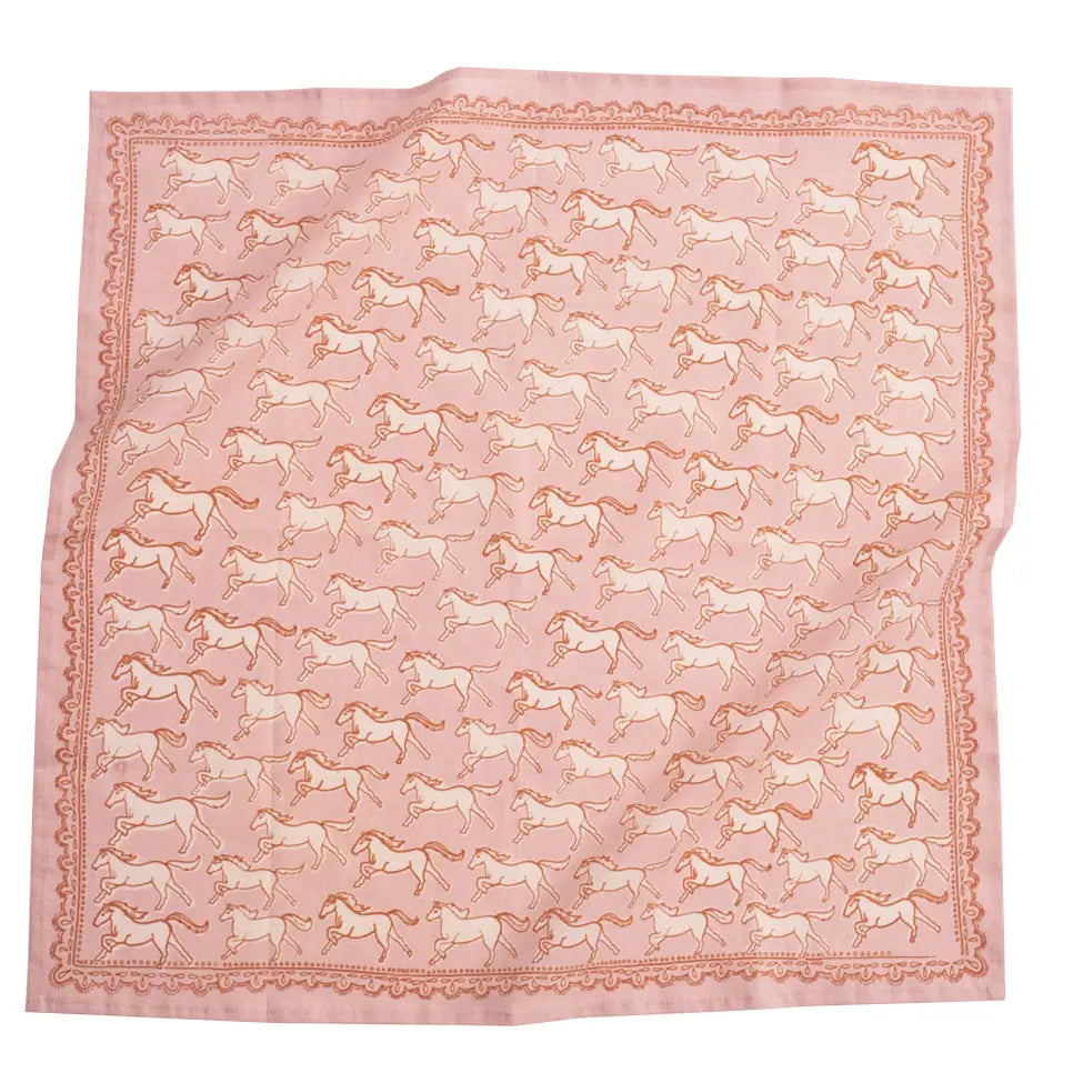 Pink fabric with horse pattern on a white background