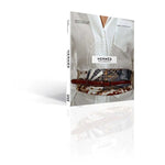 Book cover of 'Hermès Philosophy' with a person wearing a white shirt and patterned pants on a white background.