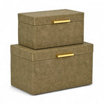 Two woven storage boxes with gold handles on a white background