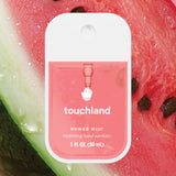 Touchland power mist hand sanitizer packaging with a watermelon background