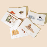 Set of greeting cards with various illustrations on a beige background