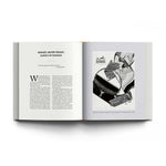 Open book with Hermès advertisement on a white background