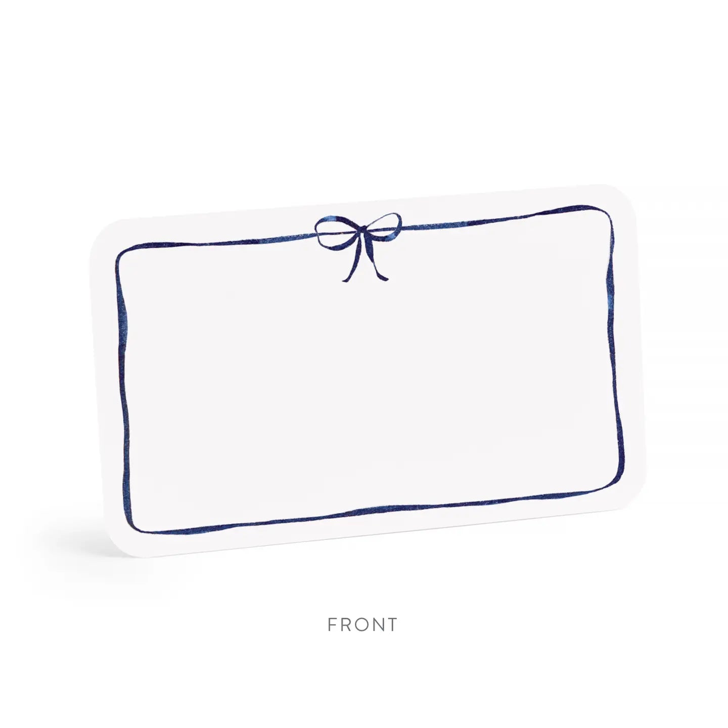 White pillow with a blue border and bow on a white background