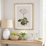 Niche with a wooden shelf, lamp, and decorative items against a light wall.