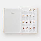 Open book showing a glossary with illustrations of food items on a white background