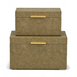 Two woven storage boxes with gold handles on a white background