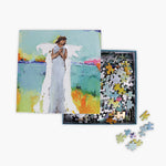 Jigsaw puzzle with an angel design on a box, featuring colorful artwork.