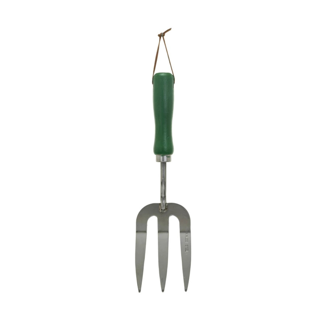 Garden fork with green handle on a white background