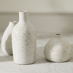 lightly speckled ceramic budvase with a rounded body & small circular opening, three sizes