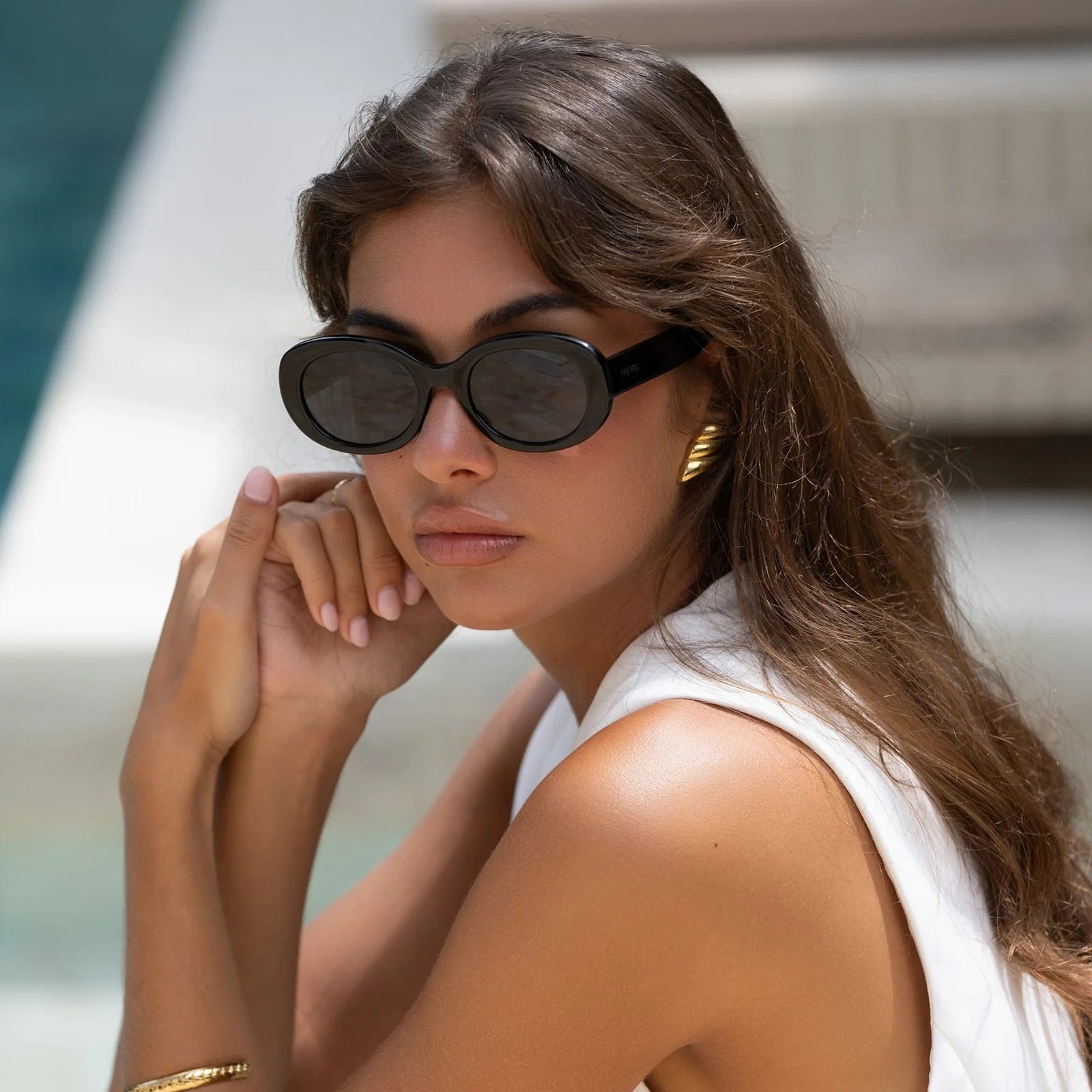 Woman wearing sunglasses with a blurred background
