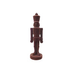 Chocolate nutcracker figurine on a white background