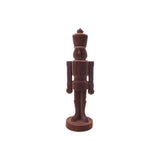 Chocolate nutcracker figurine on a white background