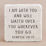 Decorative stone with engraved text on a beige background