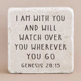 Decorative stone with engraved text on a beige background