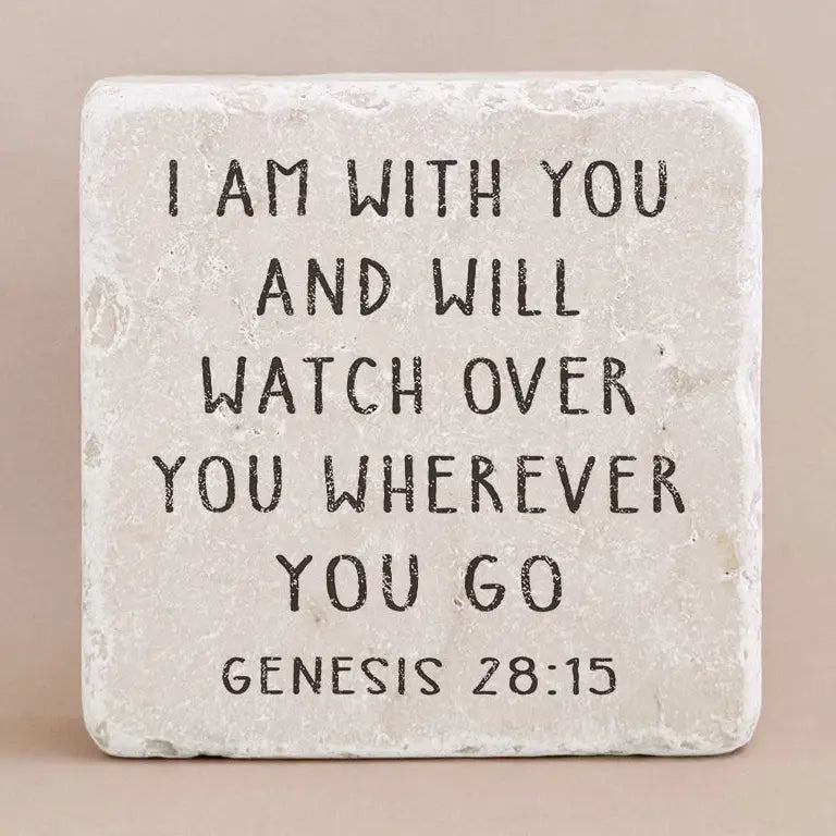 Decorative stone with engraved text on a beige background