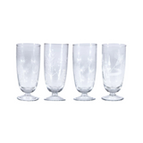 Set of four clear glass goblets with star-like patterns on a white background