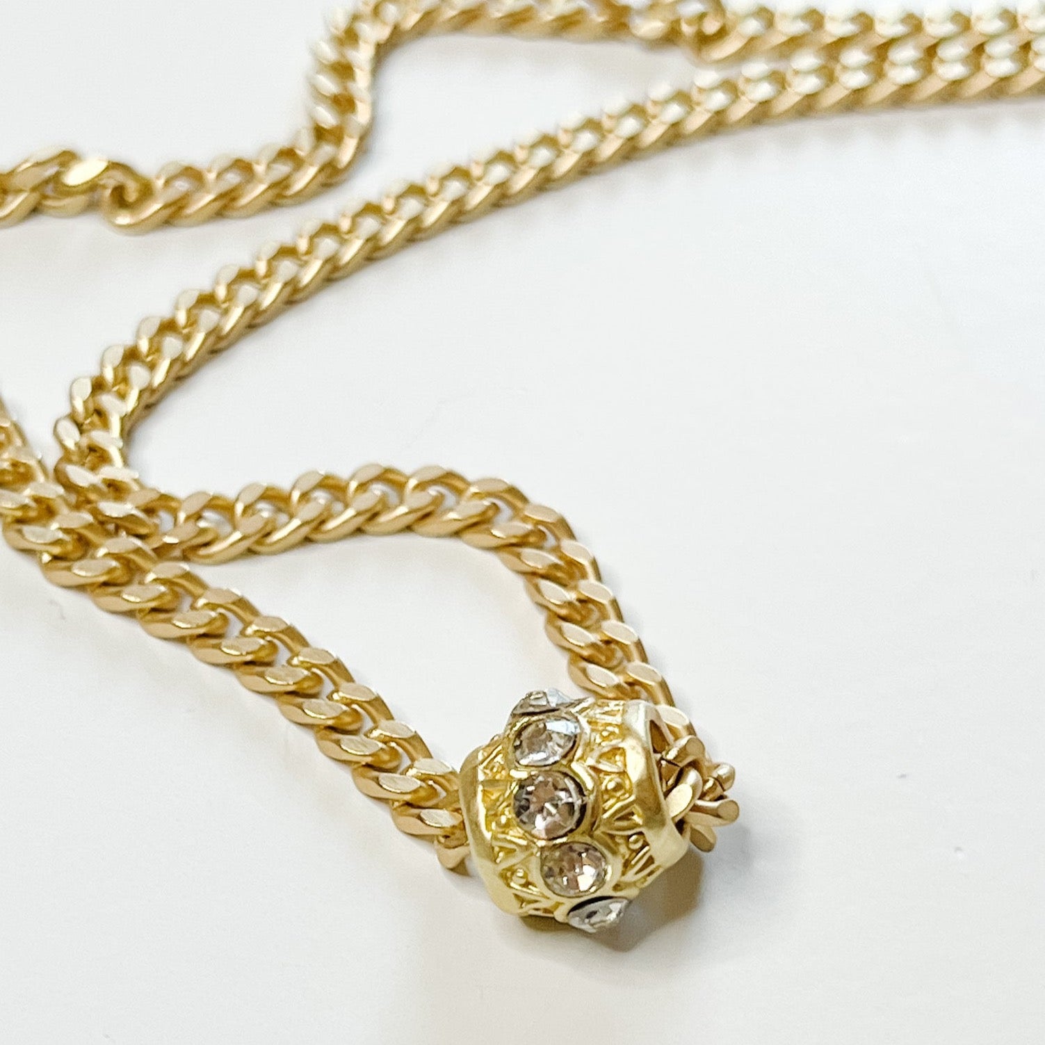 gold chain necklace with gold and faux diamond barrel pendant