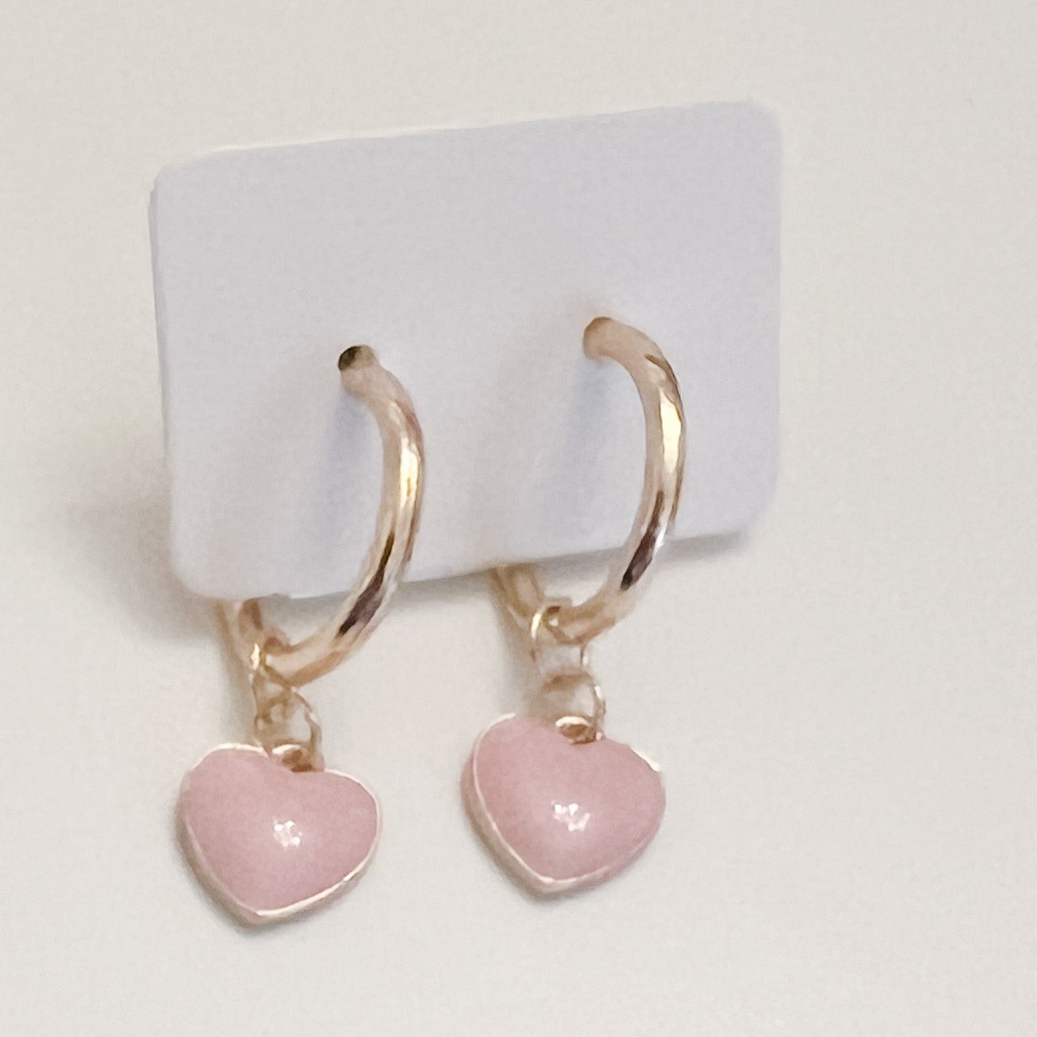 gold hoop with pink enamel heart pendant