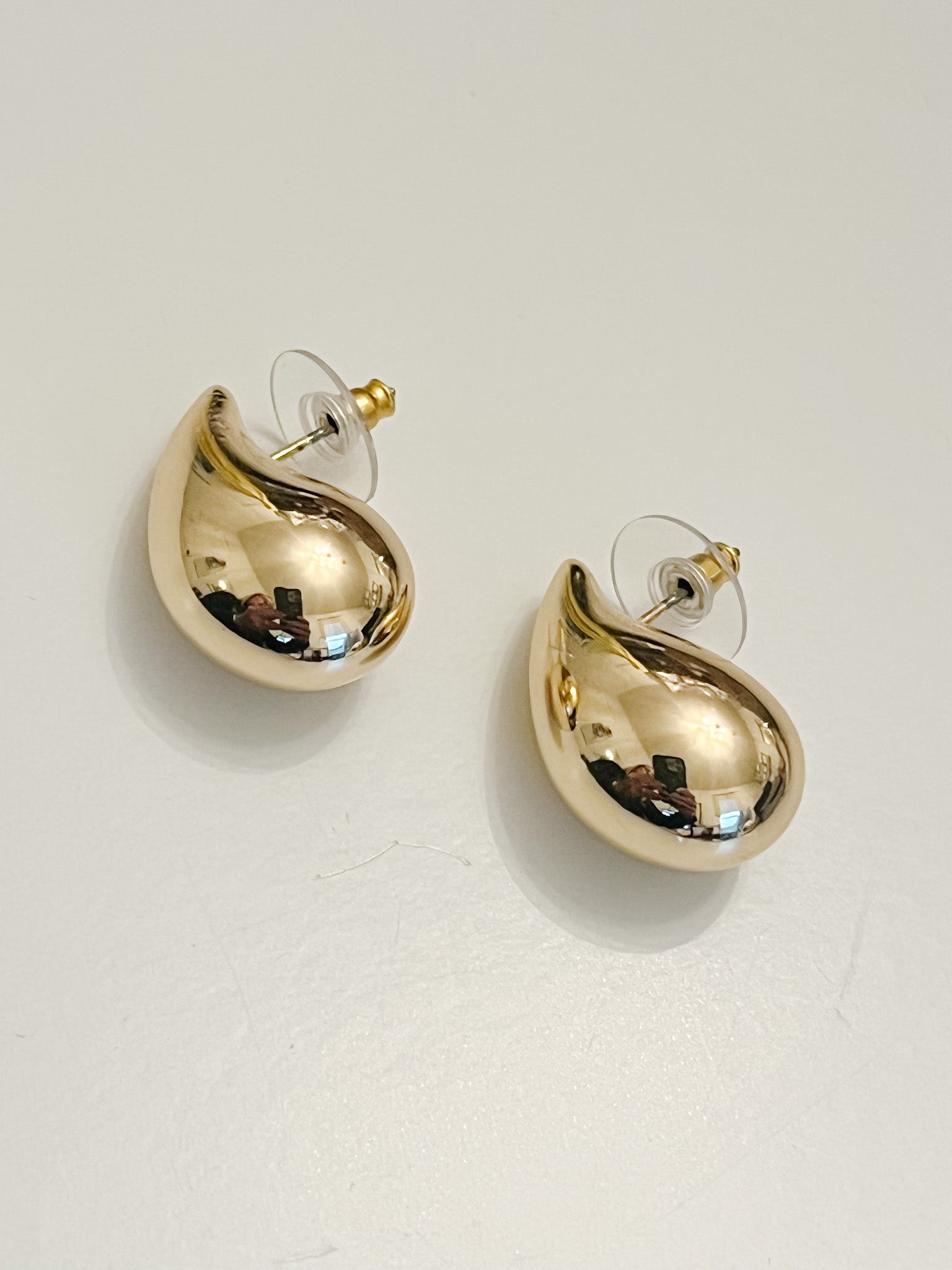 puffy tear drop gold earrings