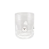 Clear glass tumbler with a small white design on a white background