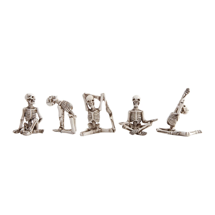 small resin skeletons in yoga positions, five styles