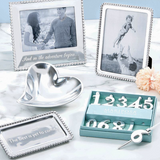 Decorative items including photo frames, a heart-shaped dish, and a box with numbers on a light blue background.