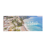 Scenic view of the Amalfi Coast with coastal buildings and clear blue water.