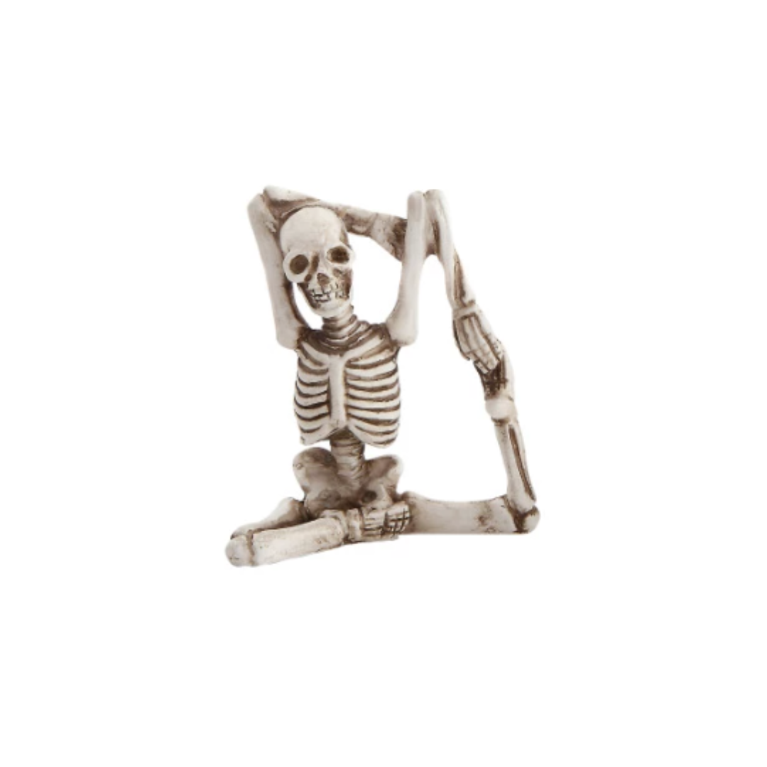 Skeletal figure with a chair on a white background