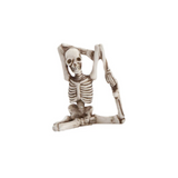 Skeletal figure with a chair on a white background