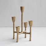 Brass candelabra with five candle holders on a white background