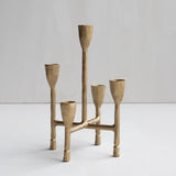 Brass candelabra with five candle holders on a white background