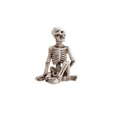 Skeletal figure in a meditative pose on a white background