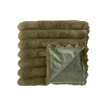 Folded green blanket with a soft texture on a white background