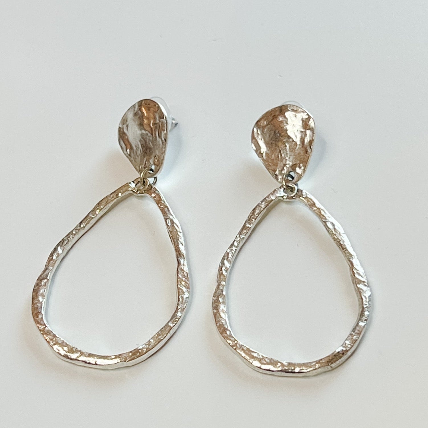 oversized silver teardrop earrings, Goodman Spalding