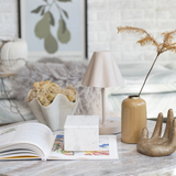 modern enameled metal vase displayed on table with