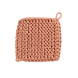 Knitted pink pot holder on a white background