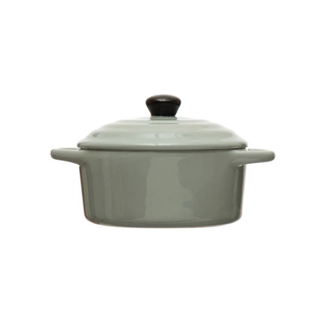 blue ceramic cooking pot with a lid on a white background