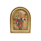 Framed art magnet of a floral arrangement with a gold frame on a white background