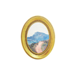 Gold-framed oval art magnet of a mountain landscape on a white background