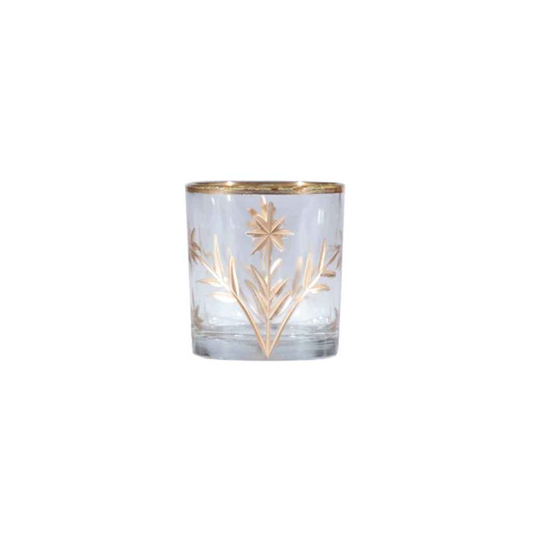 Clear glass candle holder with gold leaf design on a white background