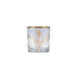 Clear glass candle holder with gold leaf design on a white background