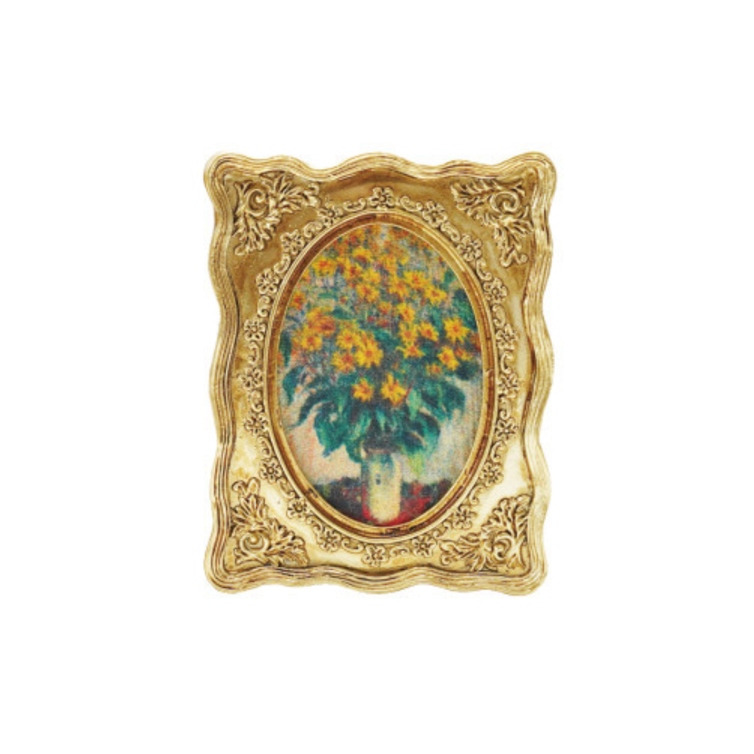 Decorative gold framed art magnet with a painting of flowers on a white background