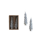 Set of Christmas tree-shaped candles, one in a box, on a white background