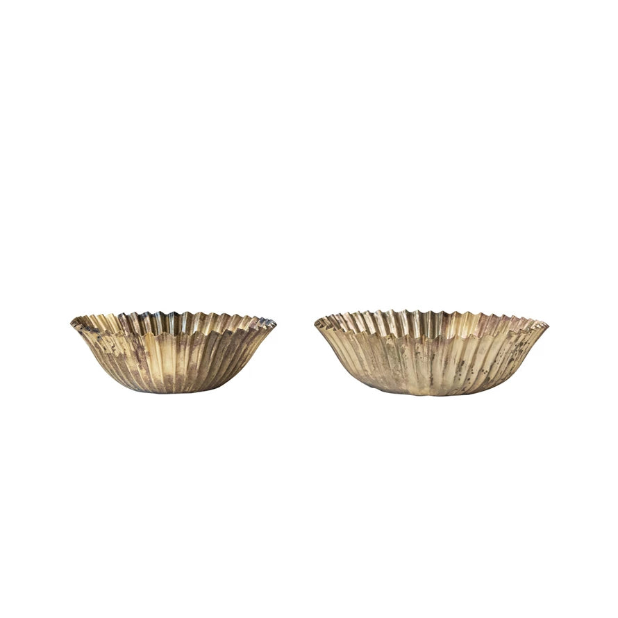 Two gold decorative bowls on a white background